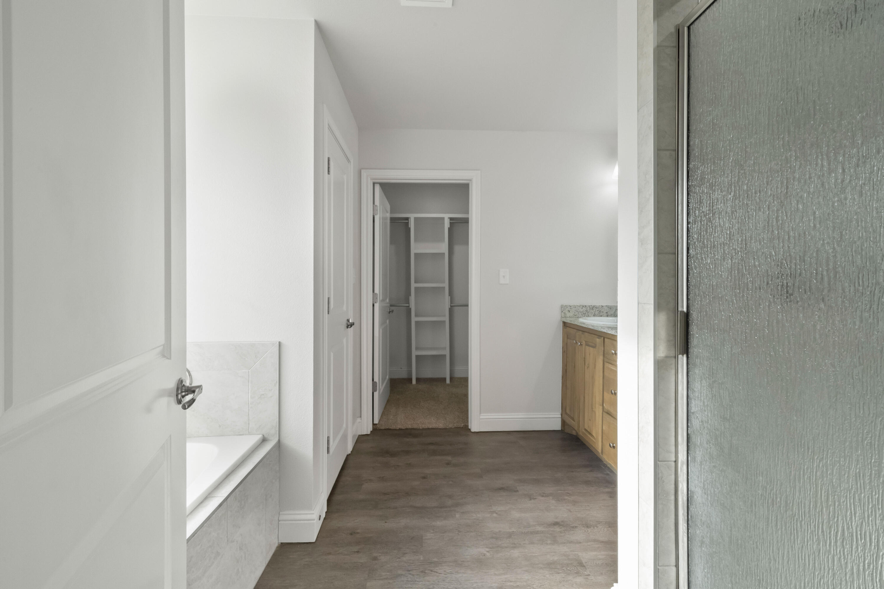 7523 87th Street Lubbock, TX 79424 - Photo 12 of 23 a view of a hallway with a white walls