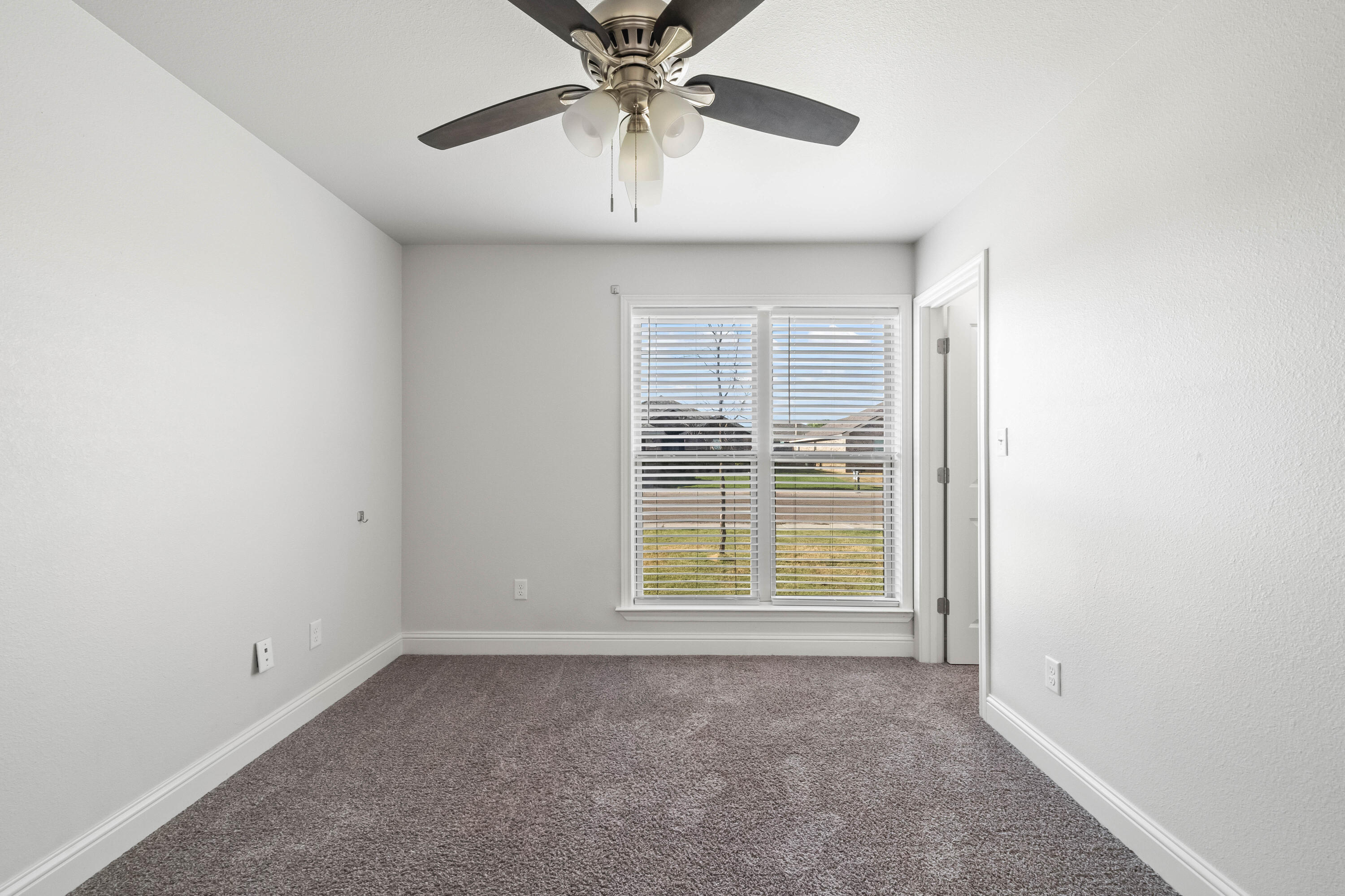 7523 87th Street Lubbock, TX 79424 - Photo 17 of 23 a view of an empty room with a window