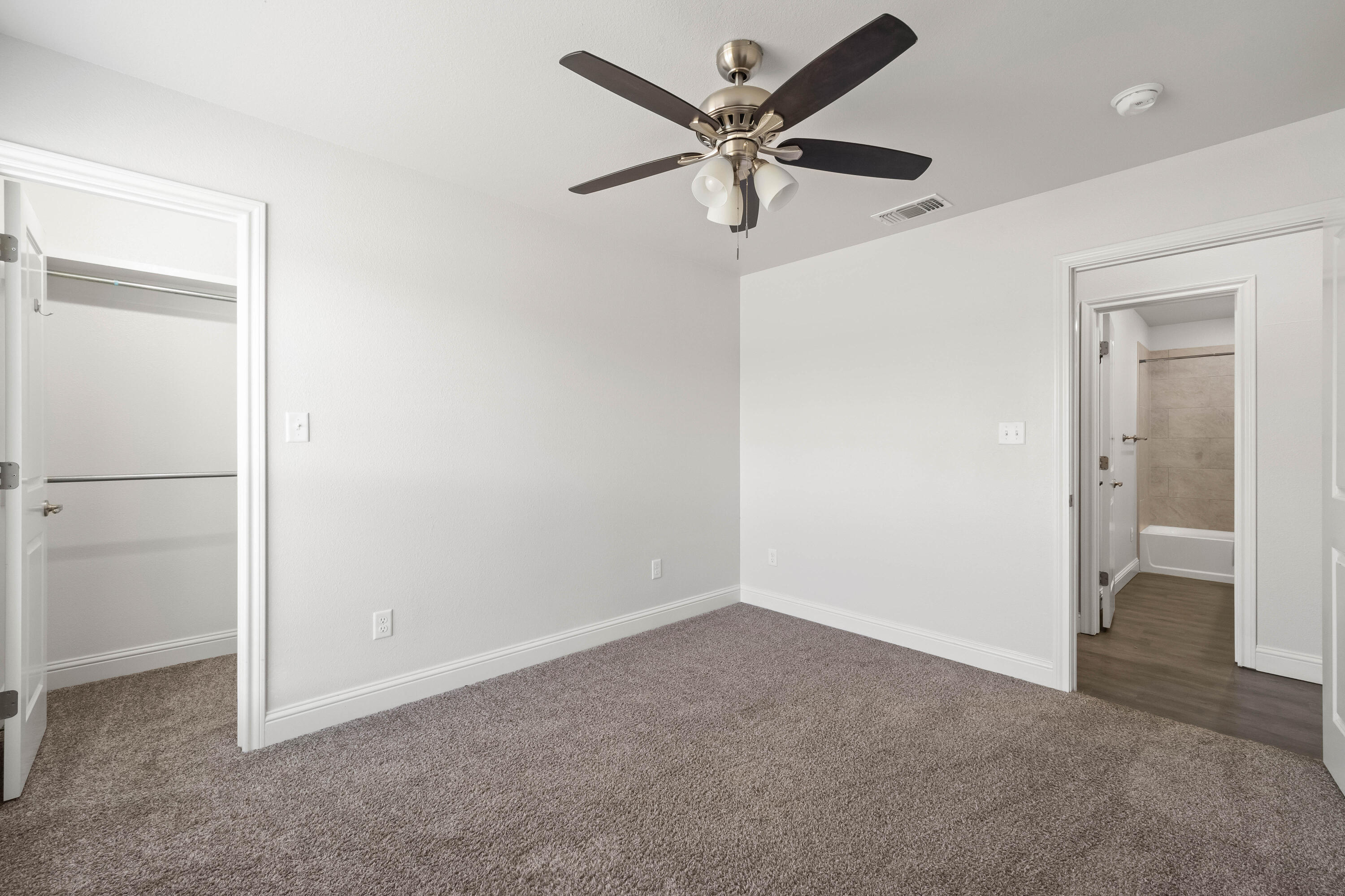 7523 87th Street Lubbock, TX 79424 - Photo 18 of 23 a view of a livingroom with a ceiling fan