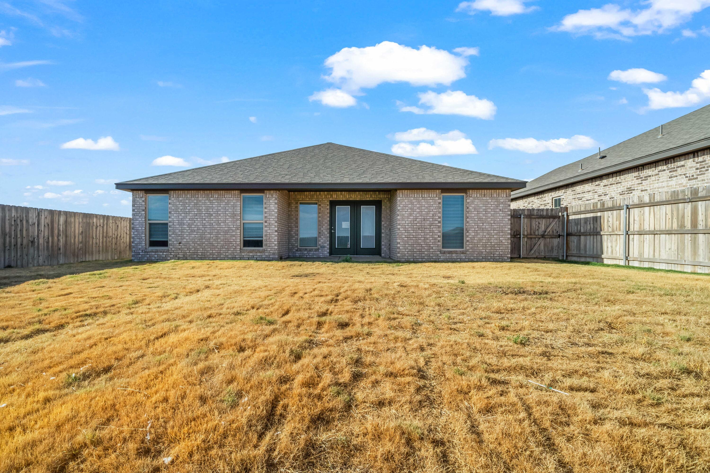 7523 87th Street Lubbock, TX 79424 - Photo 23 of 23 a view of a house with a yard