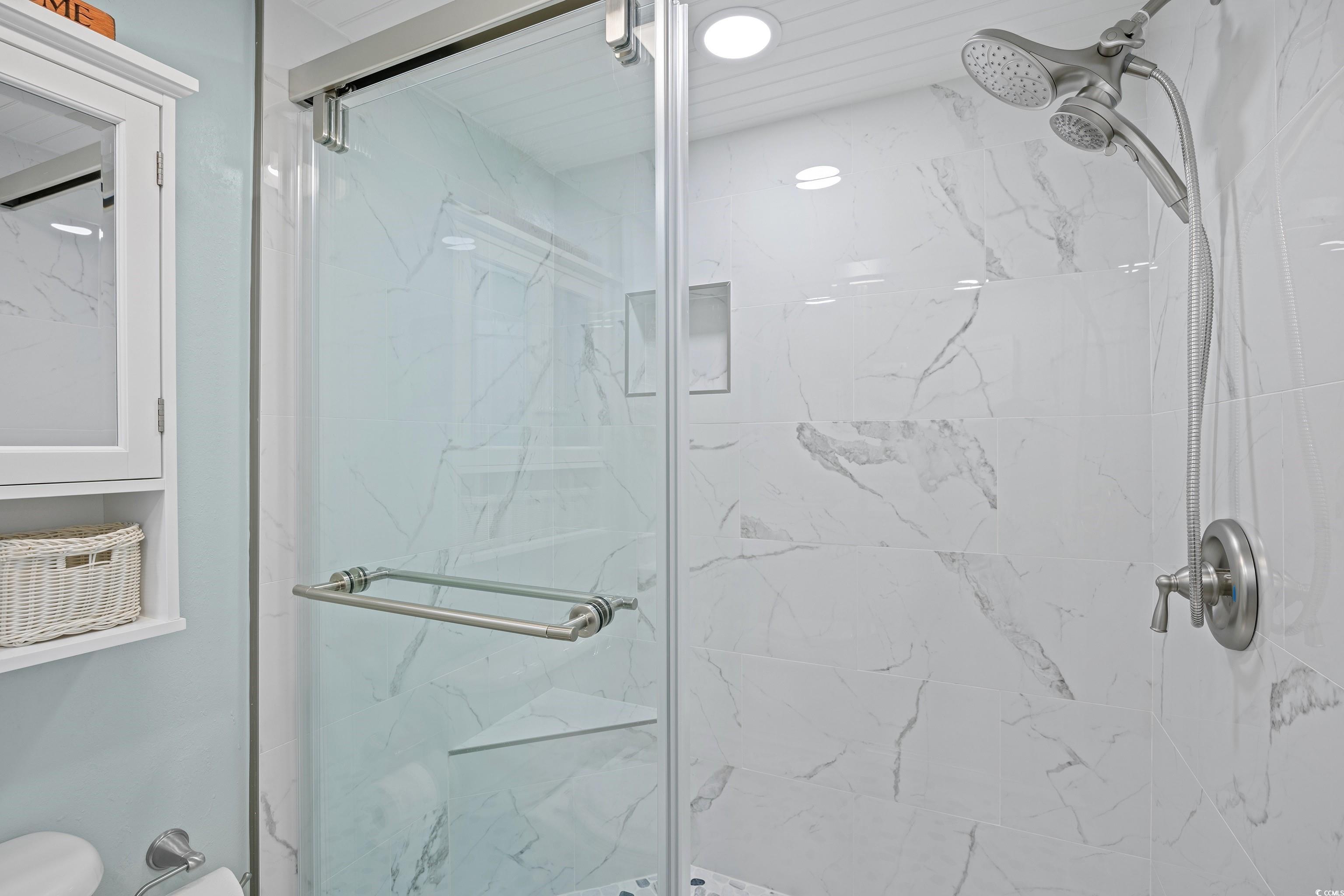 161 Seawatch Drive, Unit 1012 Myrtle Beach, SC 29572 - Photo 26 of 34 Full bathroom with a marble finish shower