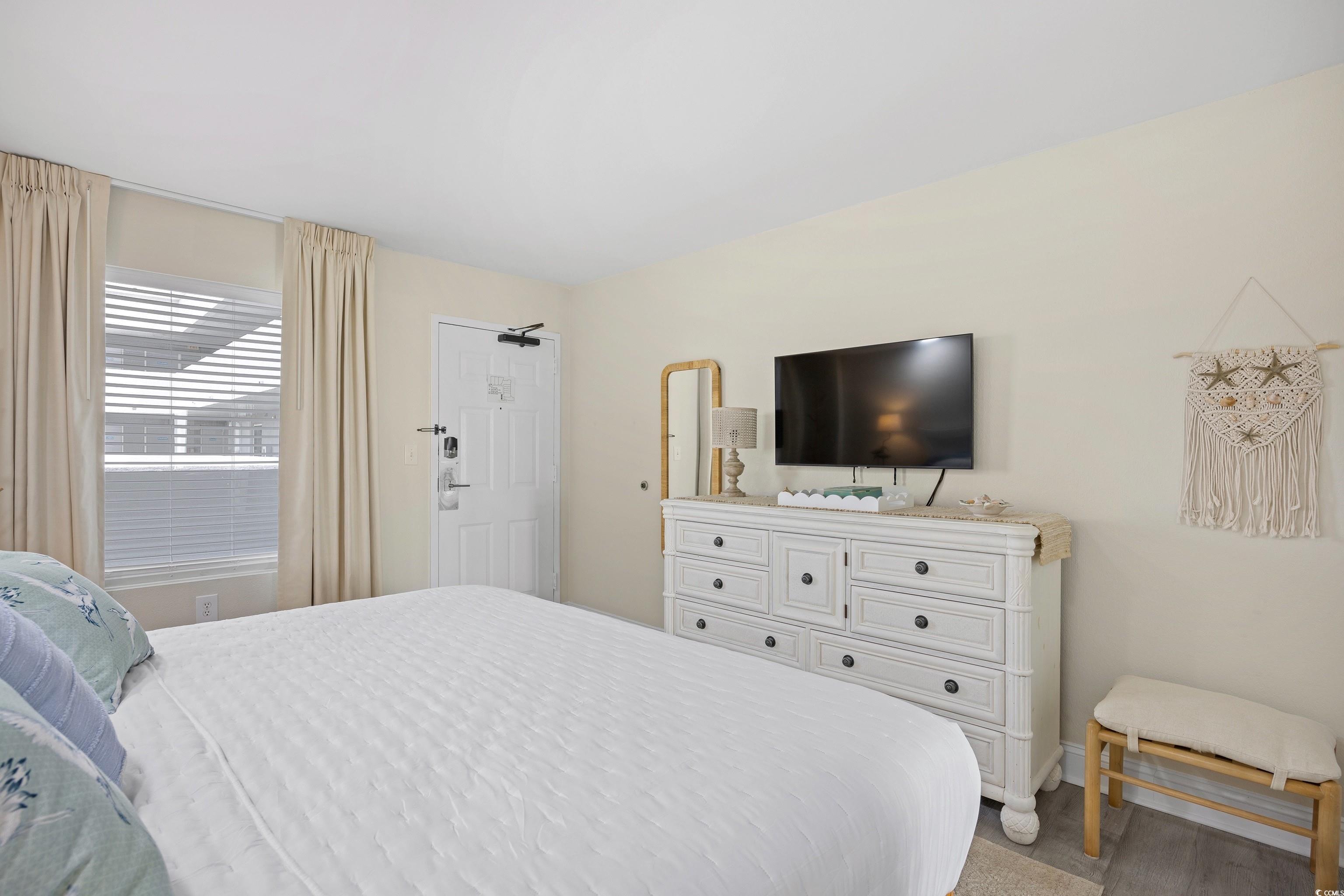 161 Seawatch Drive, Unit 1012 Myrtle Beach, SC 29572 - Photo 31 of 34 Bedroom featuring light carpet