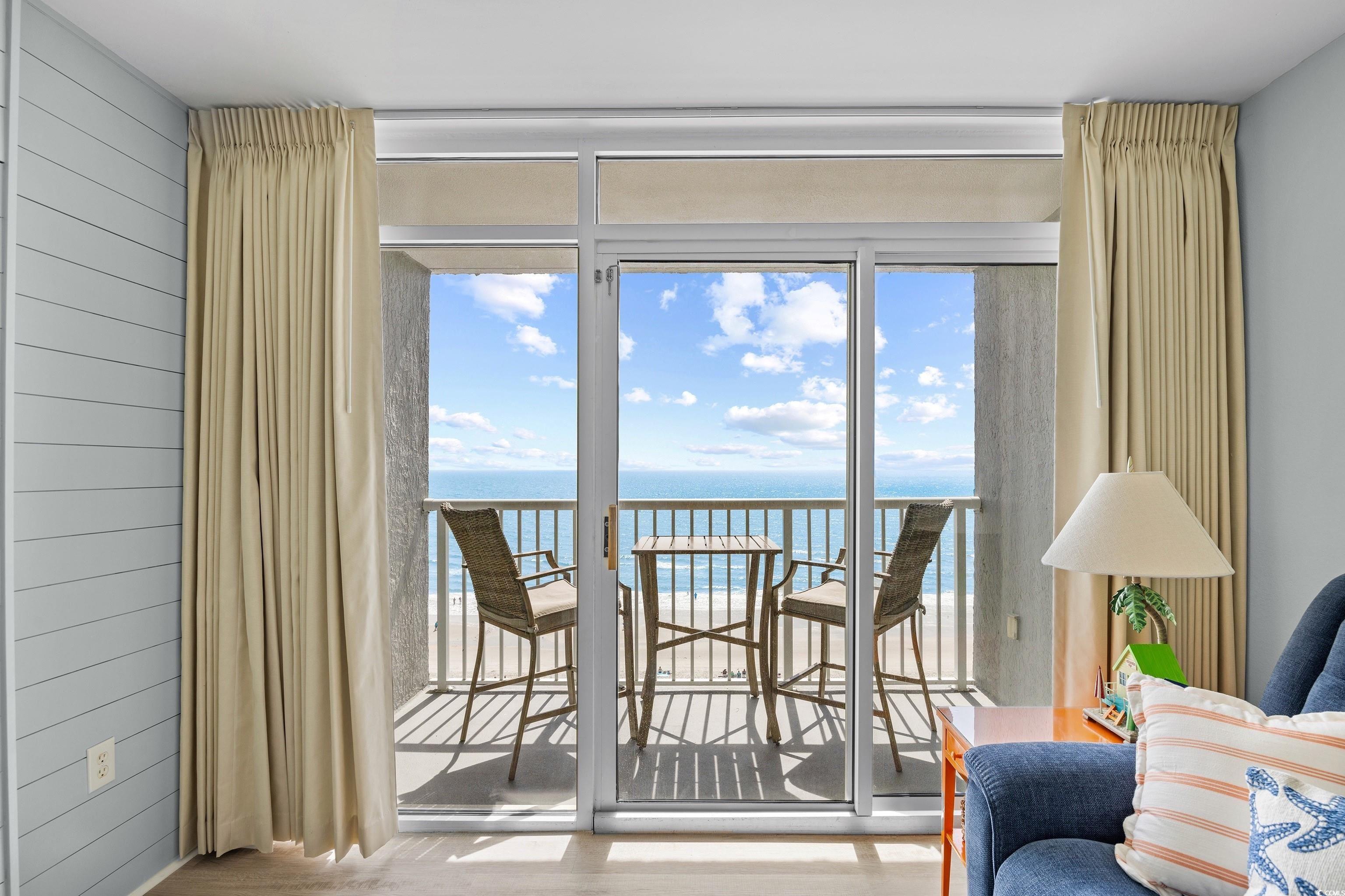 161 Seawatch Drive, Unit 1012 Myrtle Beach, SC 29572 - Photo 7 of 34 Sunroom with a water view and plenty of natural light