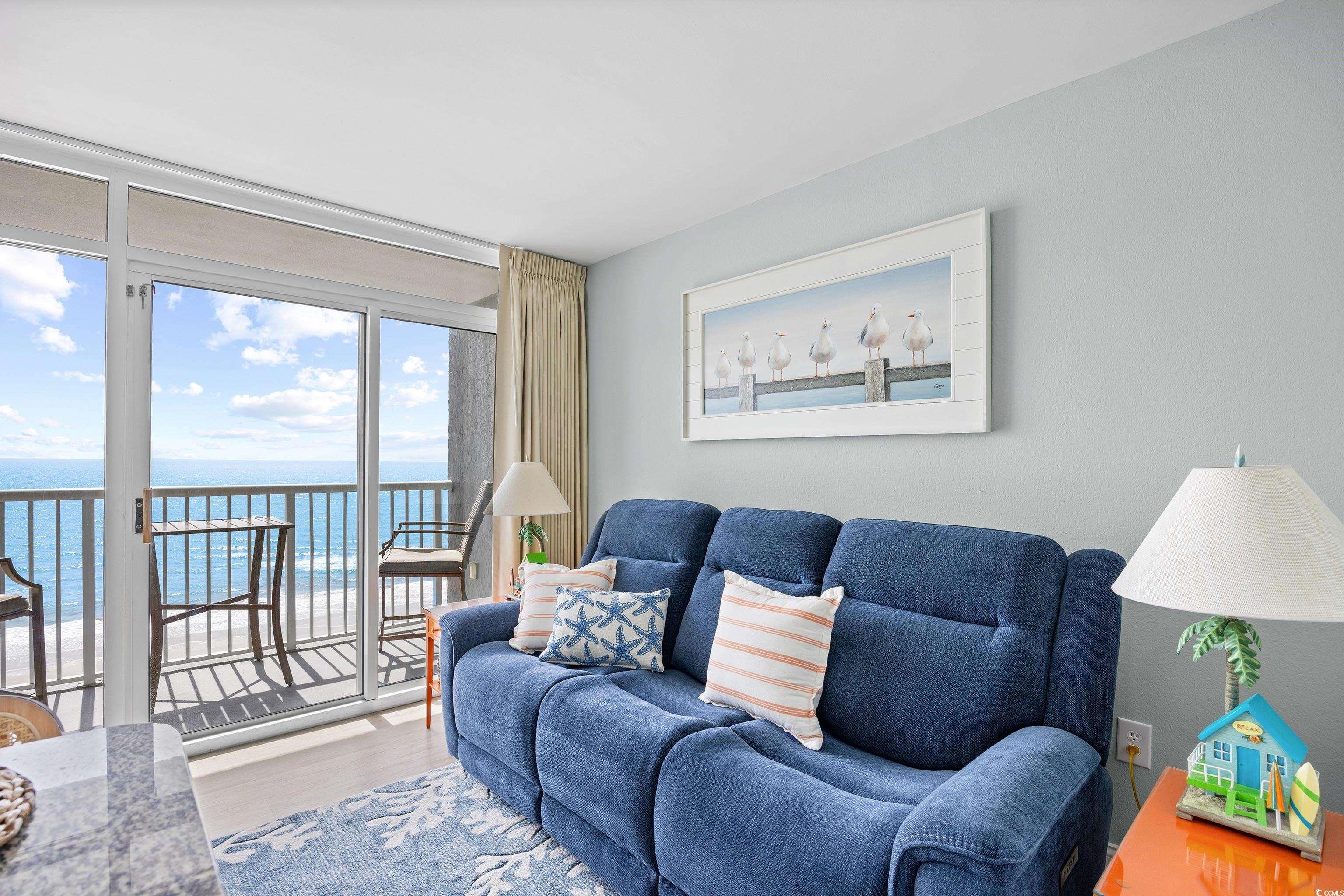 161 Seawatch Drive, Unit 1012 Myrtle Beach, SC 29572 - Photo 8 of 34 Living room with a water view and wood finished floors