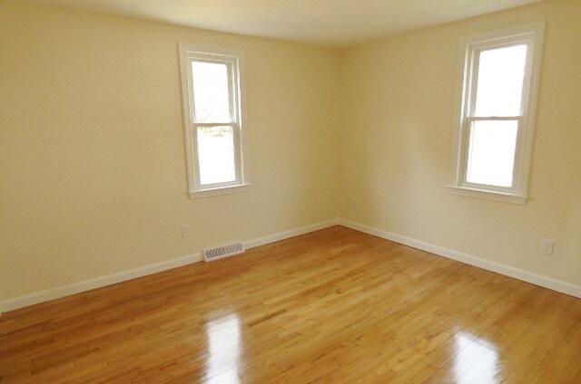3 Circuit Road North West Yarmouth, MA 02673 - Photo 17 of 28 a view of empty room with wooden floor and fan