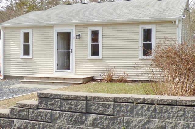 3 Circuit Road North West Yarmouth, MA 02673 - Photo 2 of 28 a front view of a house with a yard and garage