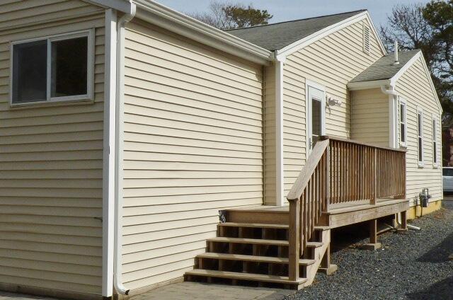 3 Circuit Road North West Yarmouth, MA 02673 - Photo 21 of 28 a view of a house with a back side deck
