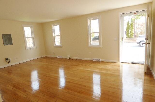 3 Circuit Road North West Yarmouth, MA 02673 - Photo 3 of 28 a view of empty room with wooden floor and fan