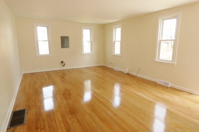 3 Circuit Road North West Yarmouth, MA 02673 - Photo 4 of 28 a view of a big room with wooden floor and windows