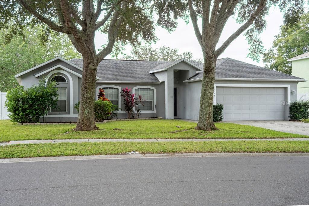 1723 Lochshyre Loop Ocoee, FL 34761 - Photo 1 of 23 a front view of a house with a yard and a garage