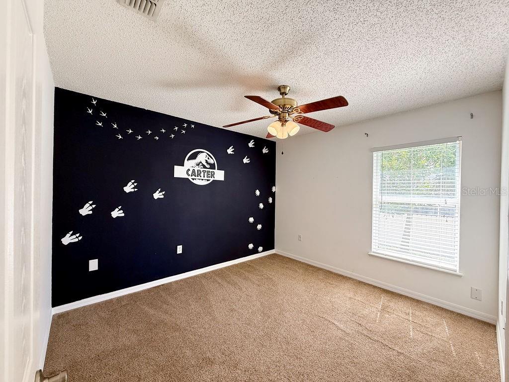 1723 Lochshyre Loop Ocoee, FL 34761 - Photo 13 of 23 a view of an empty room with a window