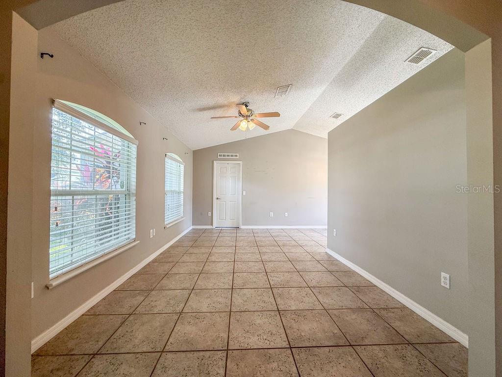 1723 Lochshyre Loop Ocoee, FL 34761 - Photo 2 of 23 a view of an empty room with a window
