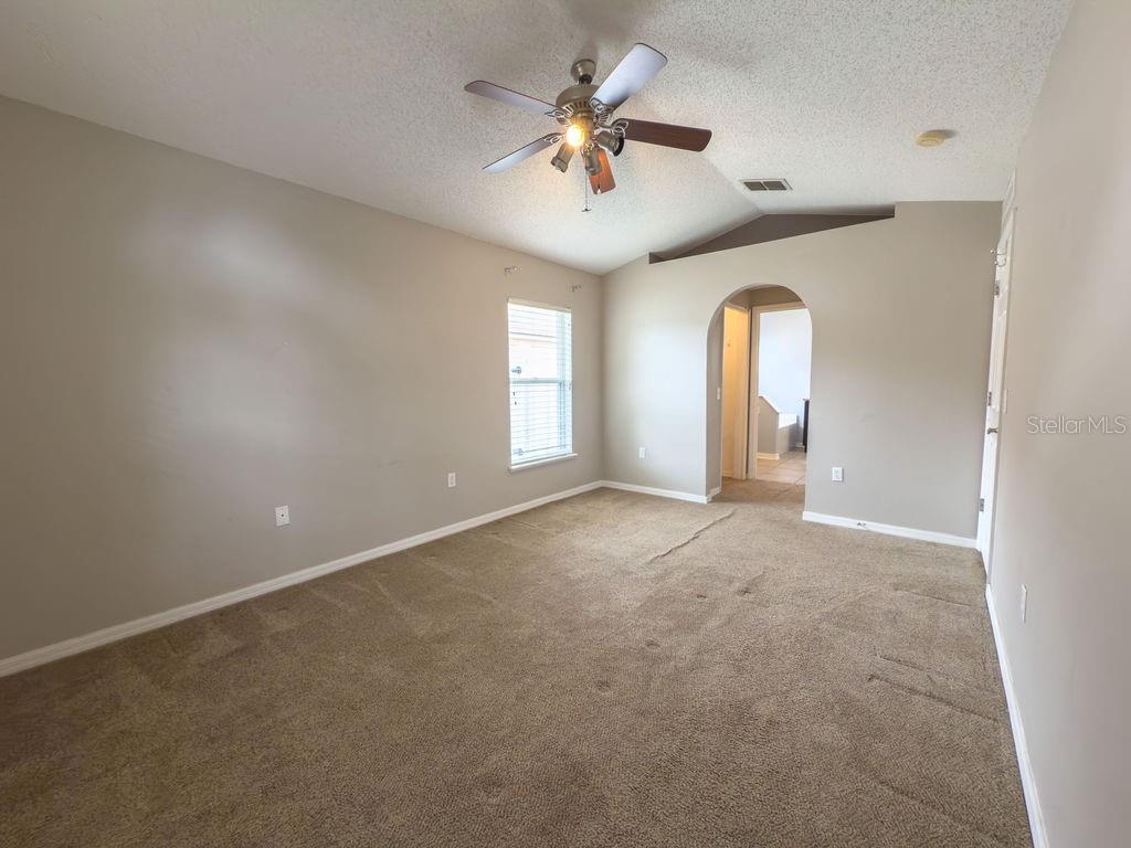 1723 Lochshyre Loop Ocoee, FL 34761 - Photo 10 of 23 an empty room with windows and fan