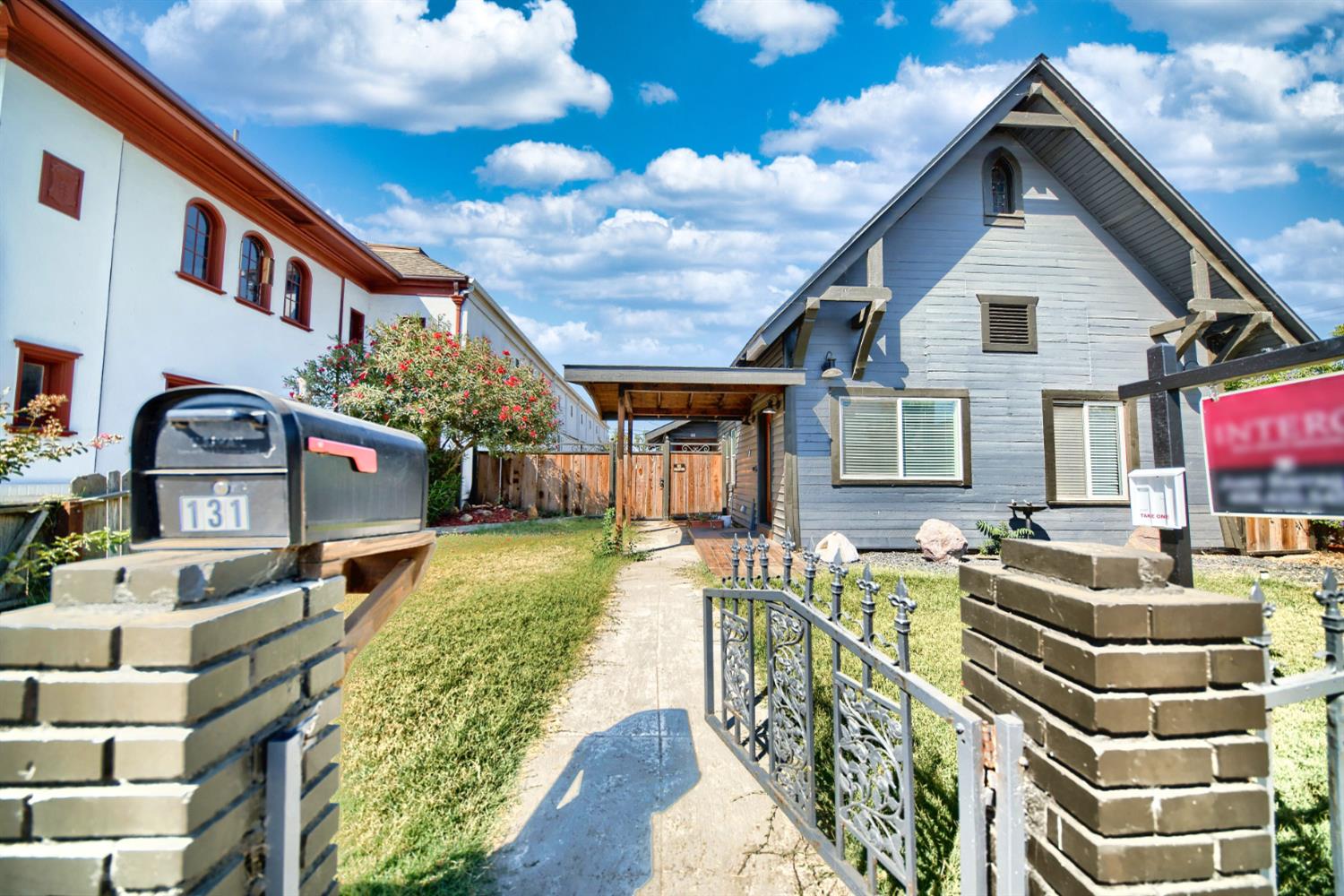 131 5th Street Gustine, CA 95322 - Photo 17 of 92 a front view of a house with a yard
