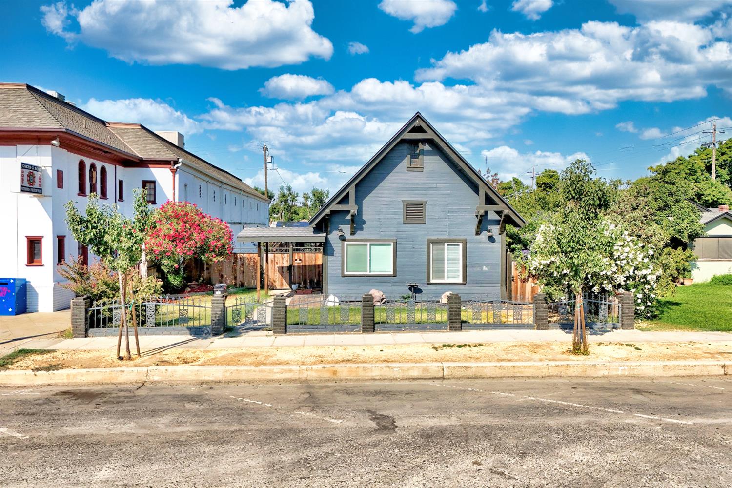 131 5th Street Gustine, CA 95322 - Photo 2 of 92 a front view of a house with a yard