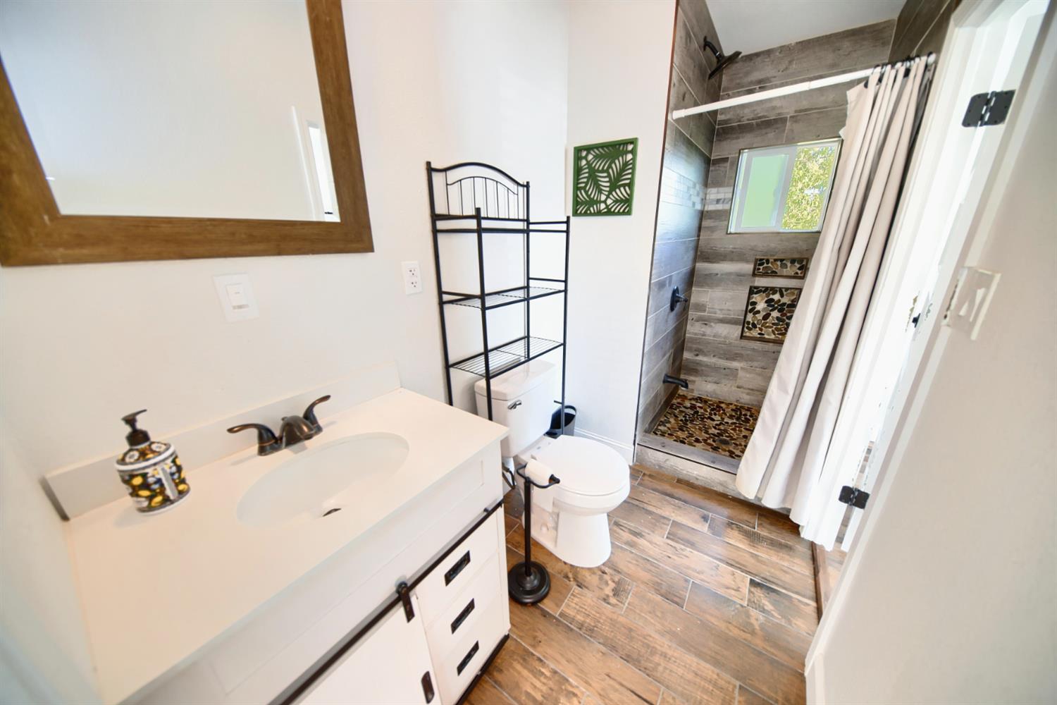 131 5th Street Gustine, CA 95322 - Photo 34 of 92 a bathroom with a sink and a mirror
