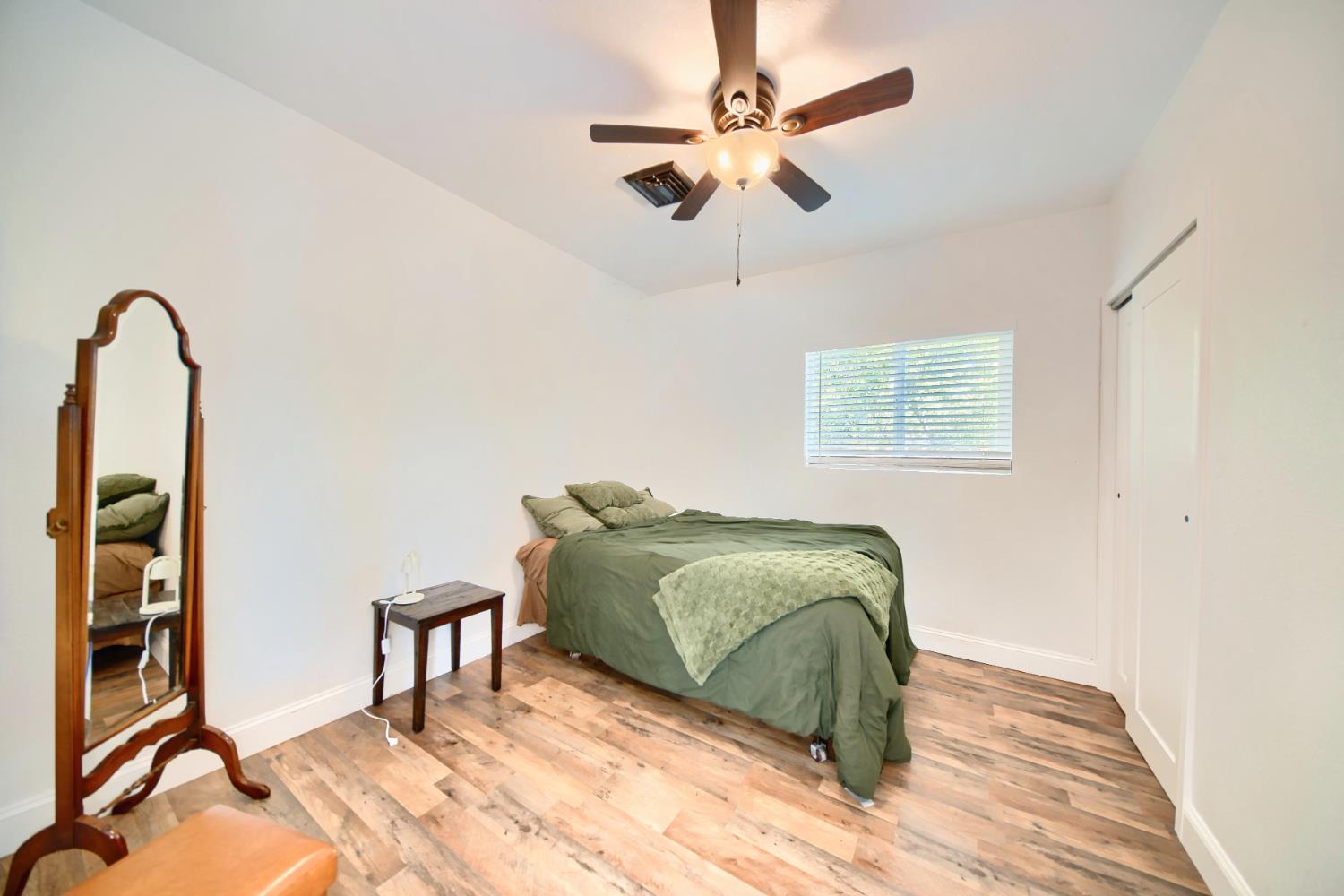 131 5th Street Gustine, CA 95322 - Photo 38 of 92 a living room with a bed furniture and a window