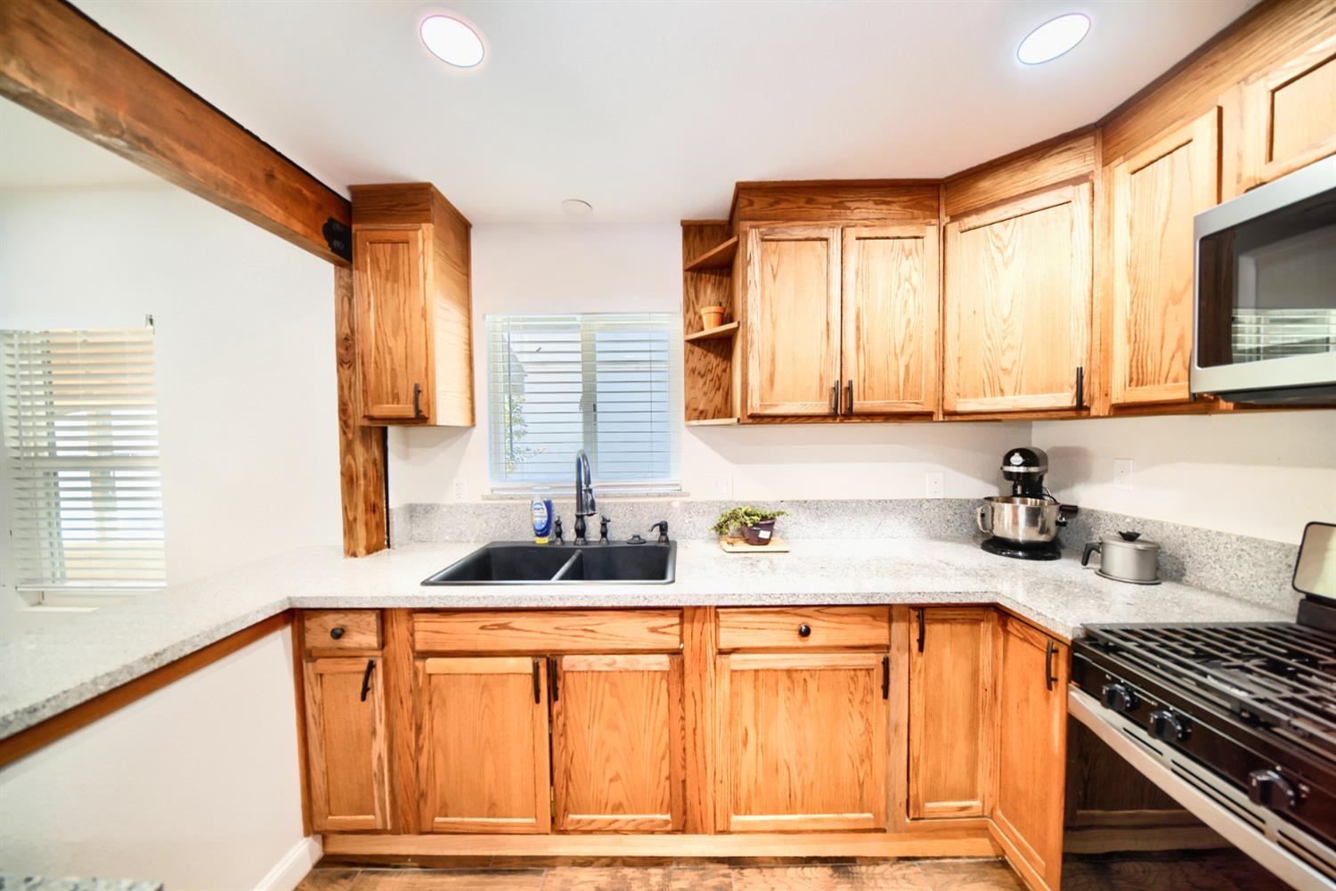131 5th Street Gustine, CA 95322 - Photo 61 of 92 a kitchen with stainless steel appliances granite countertop a sink stove and cabinets