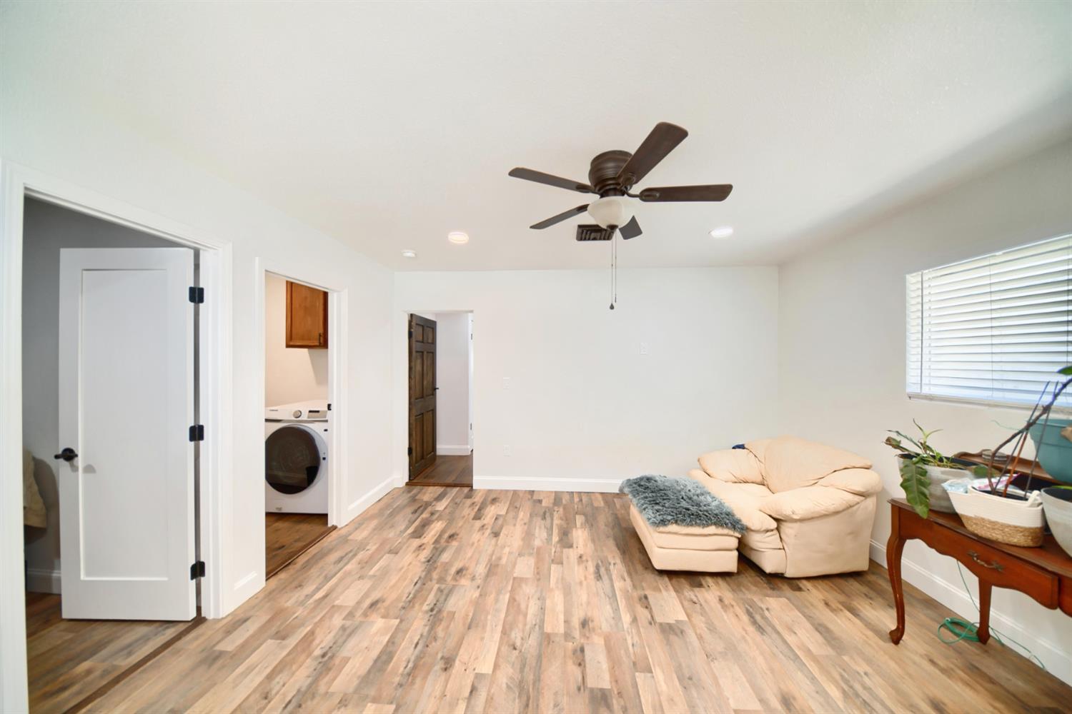 131 5th Street Gustine, CA 95322 - Photo 66 of 92 a spacious bedroom with a bed and wooden floor