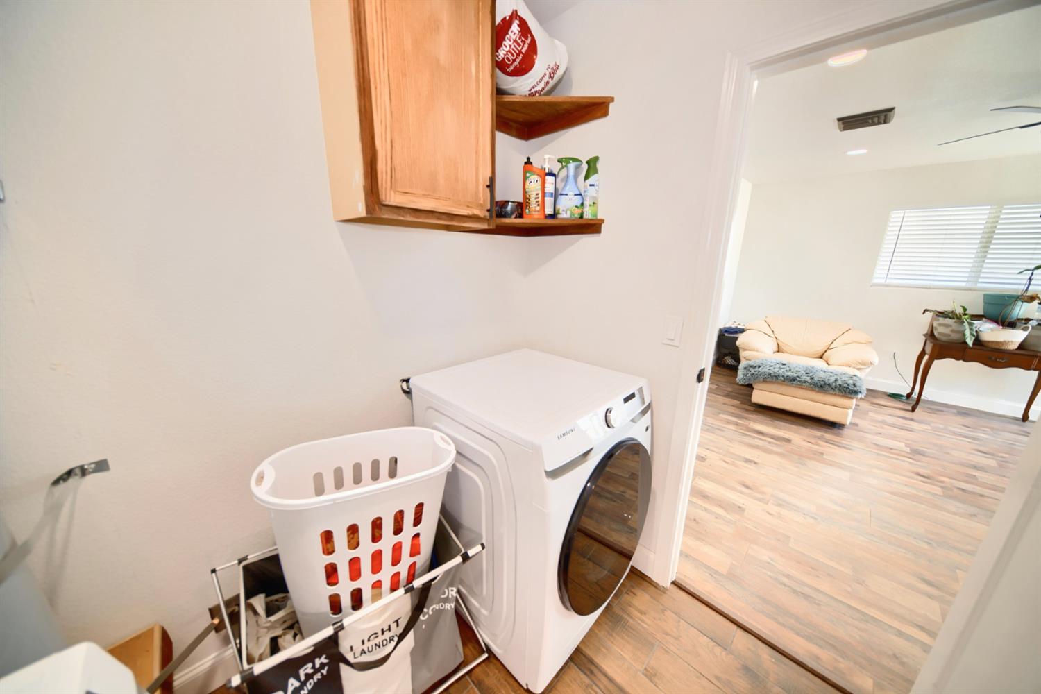 131 5th Street Gustine, CA 95322 - Photo 71 of 92 a bedroom with furniture and a wooden floor
