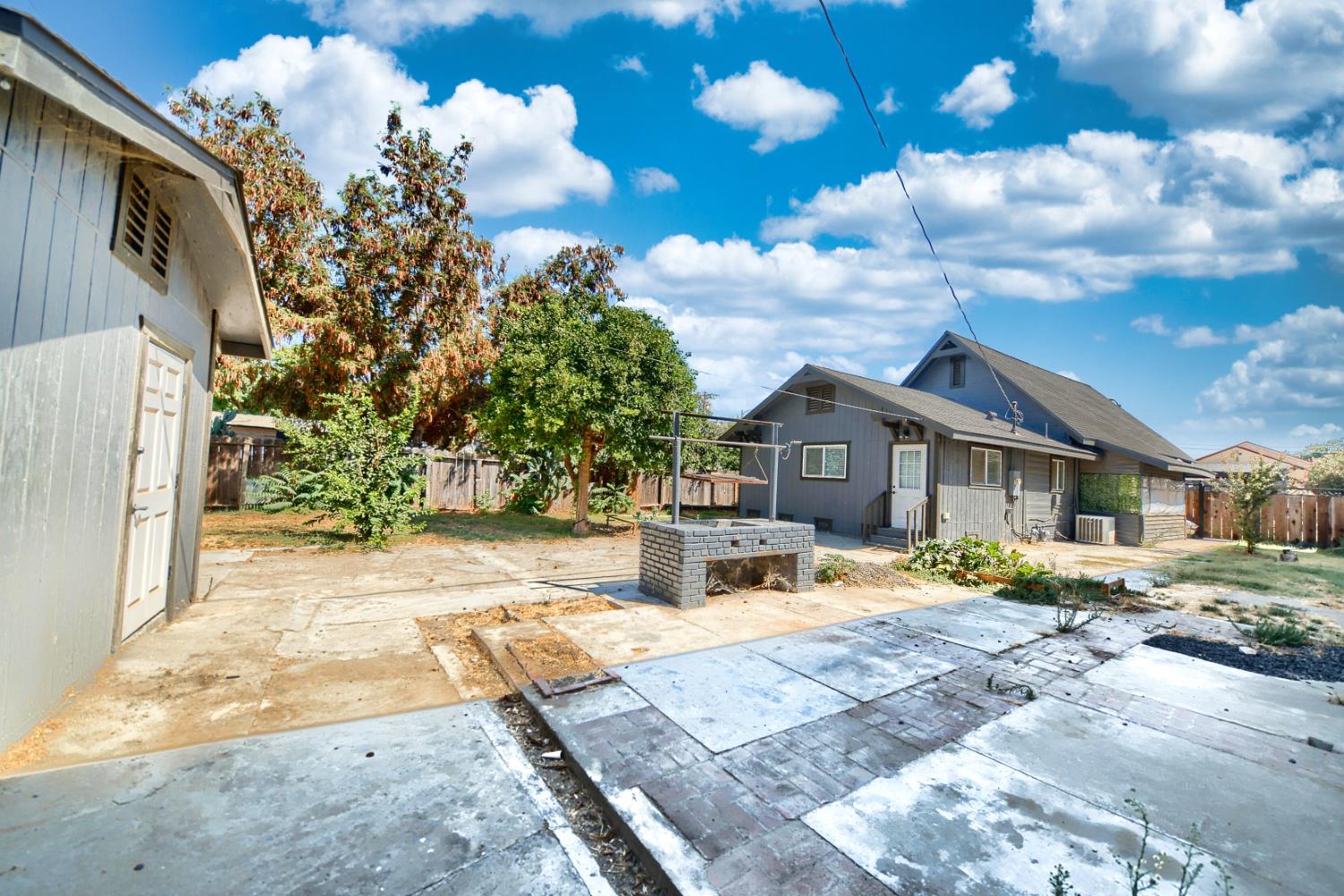 131 5th Street Gustine, CA 95322 - Photo 77 of 92 a front view of a house with a yard