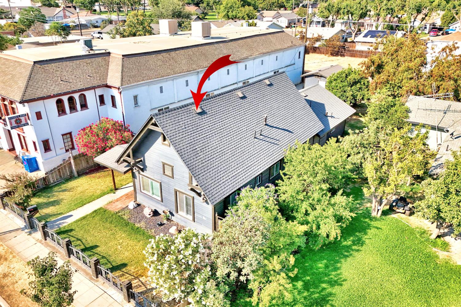 131 5th Street Gustine, CA 95322 - Photo 86 of 92 an aerial view of a house with a yard and potted plants