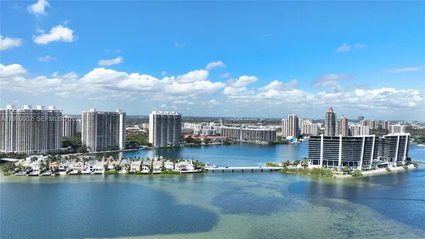 a view of a lake with tall building