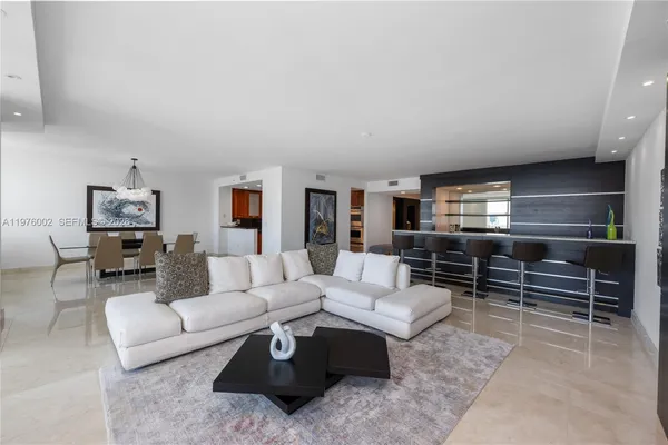 a living room with furniture and a table