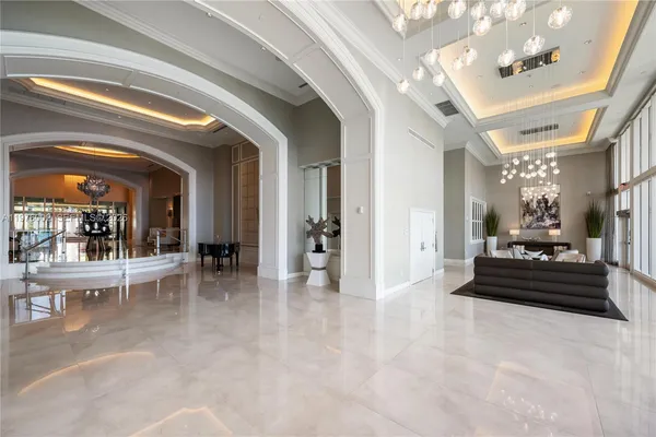 a living room with furniture and a large mirror