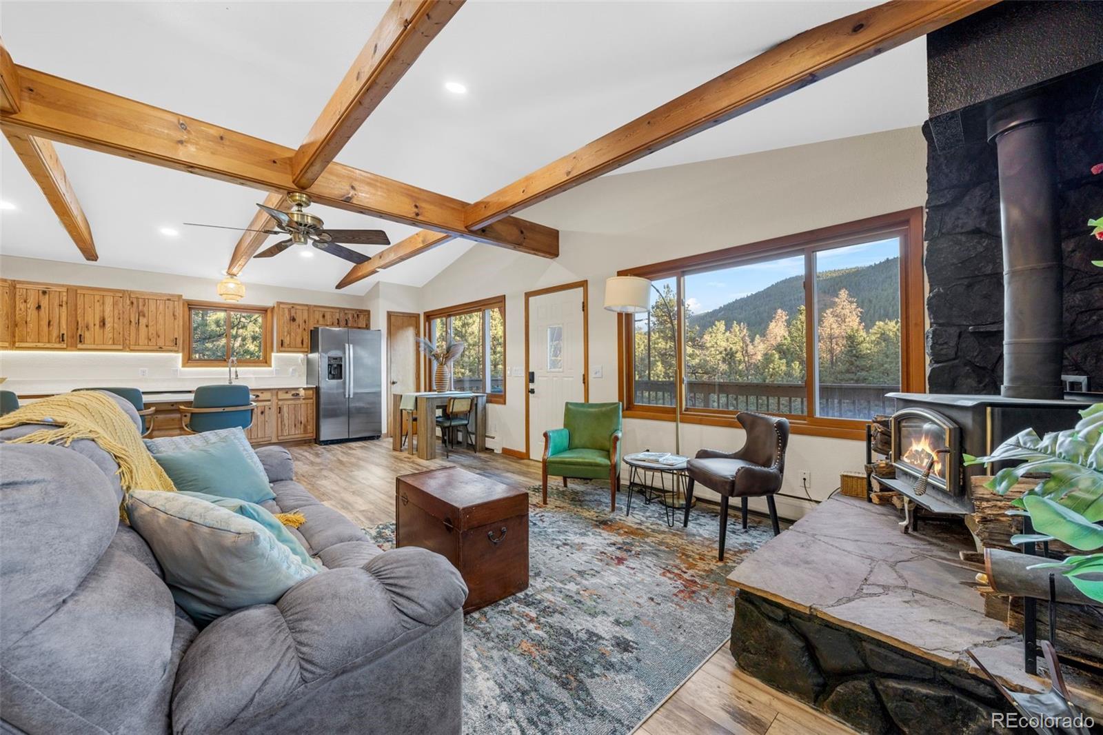 22 Driver Road Bailey, CO 80421 - Photo 9 of 24 a living room with furniture and a large window
