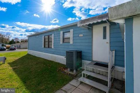 a backyard of a house with seating space