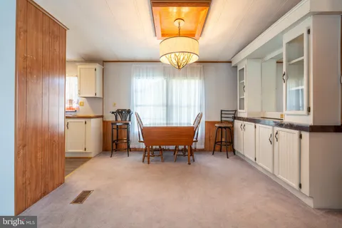 a view of a kitchen with furniture and windows
