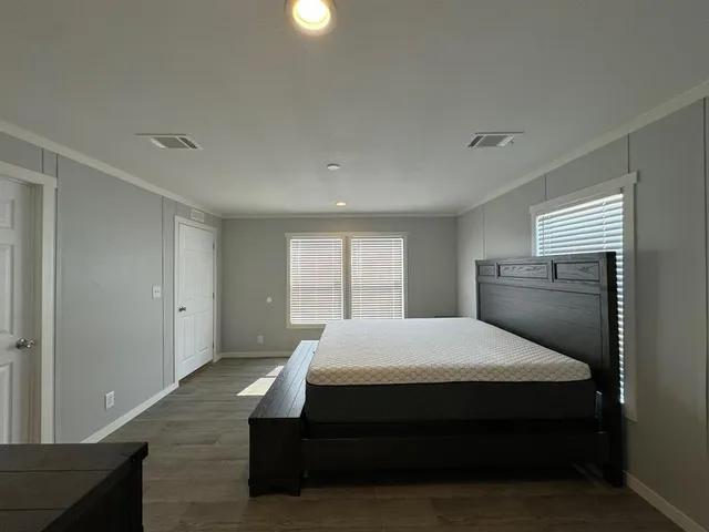 a bedroom with a bed and window