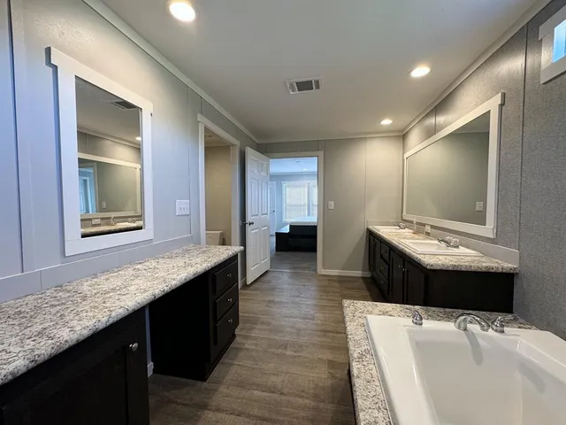 a kitchen with a sink and a refrigerator