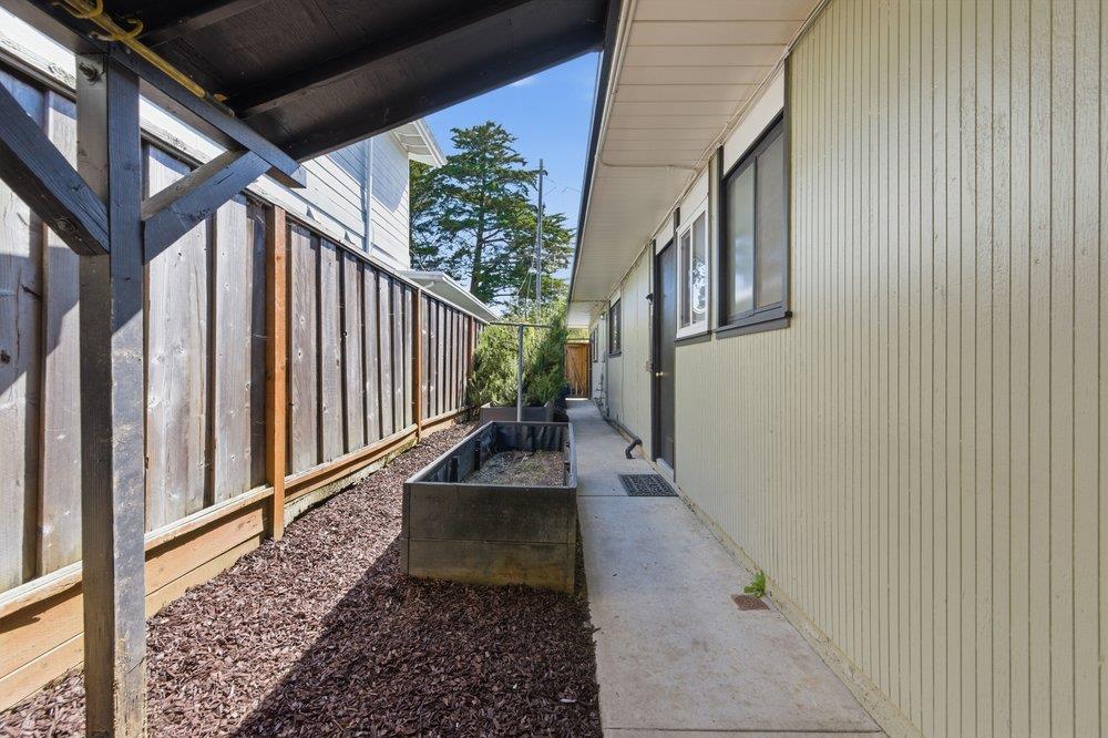 2203 Allegheny Way San Mateo, CA 94402 - Photo 33 of 56 a view of a pathway of a house with wooden floor