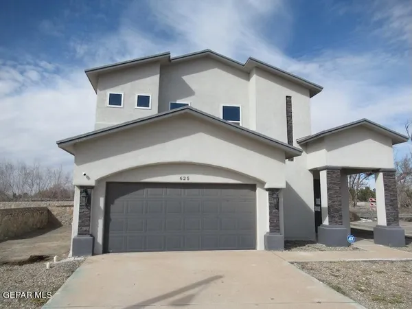 a front view of a house with yard