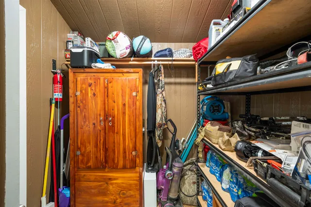 a view of a house with backyard and trees