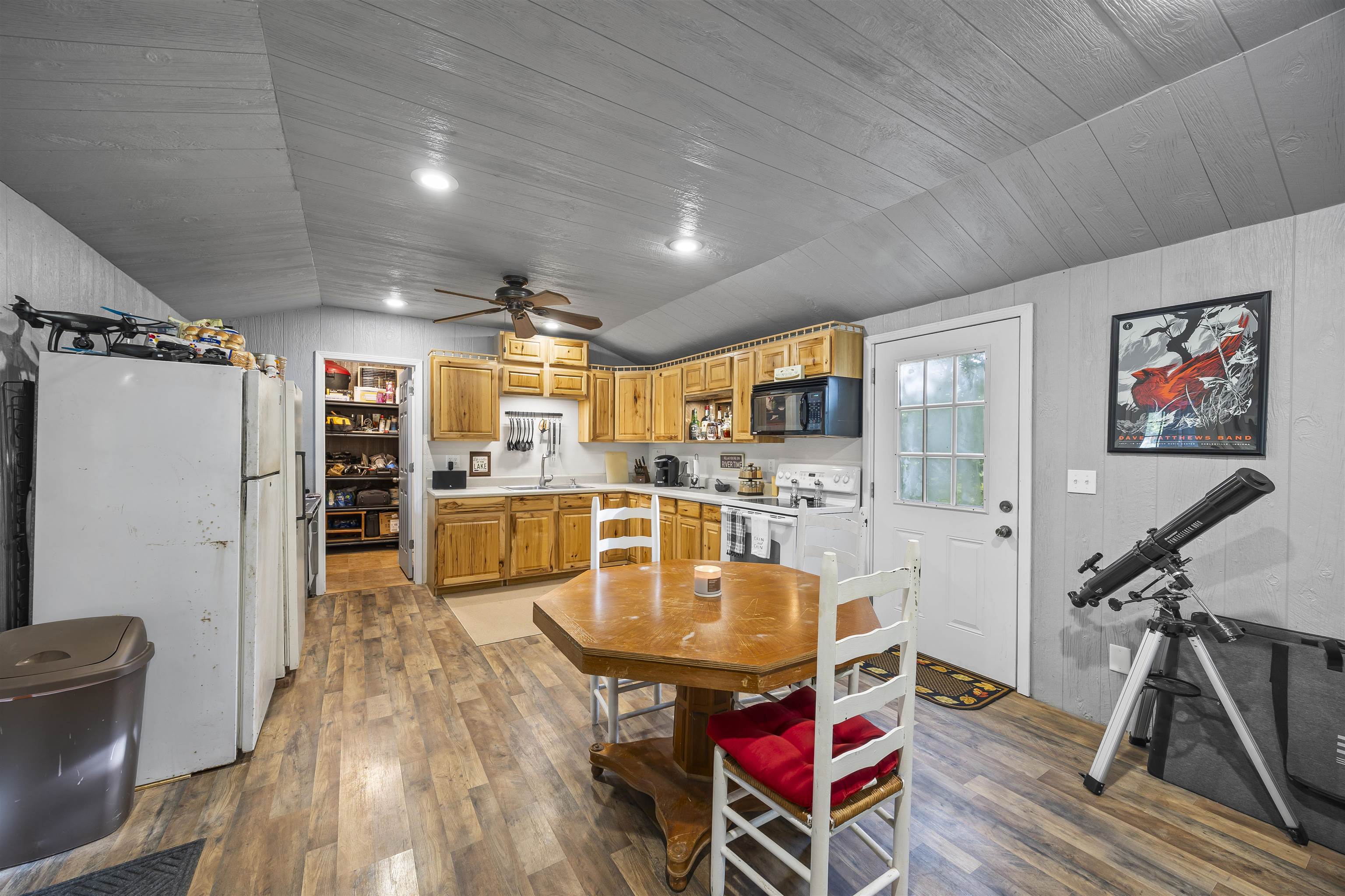 4830 Kendall Road Hornbeak, TN 38232 - Photo 5 of 37 a living room with stainless steel appliances furniture a kitchen view and wooden floor