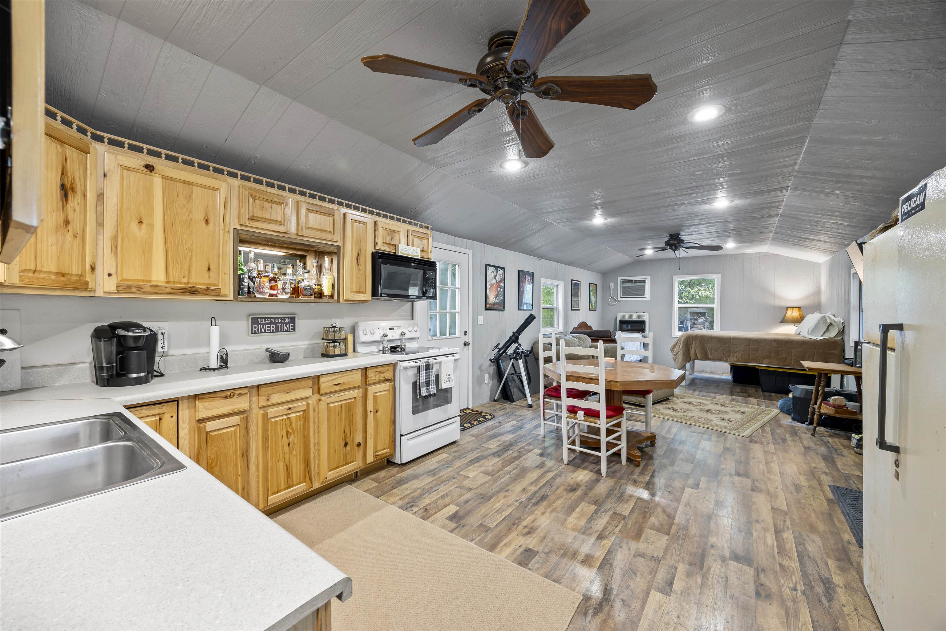 4830 Kendall Road Hornbeak, TN 38232 - Photo 6 of 37 a kitchen with stainless steel appliances granite countertop a sink dishwasher a stove and a microwave oven with cabinets