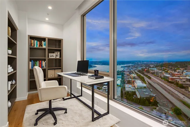 a view of a workspace with furniture