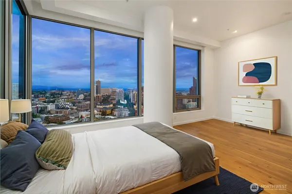 a bedroom with a large bed and a window