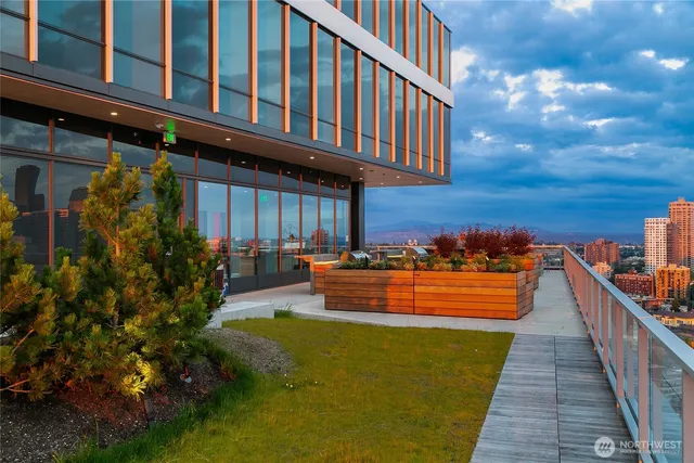 a view of a terrace with furniture and a fire pit