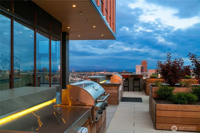 a living room with furniture fireplace and a large window