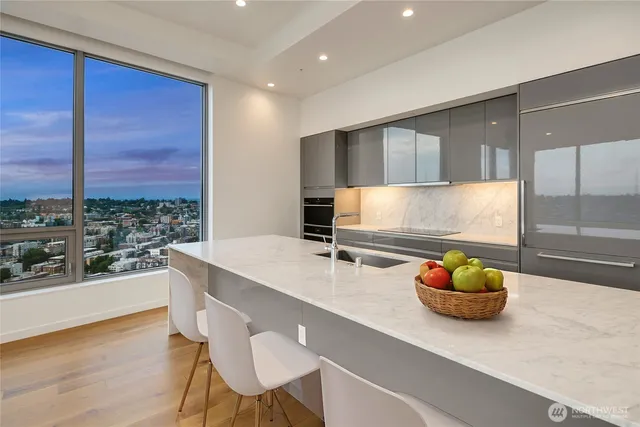a kitchen with a table and chairs