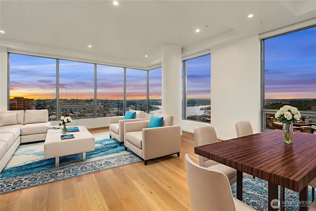 a living room with furniture and a floor to ceiling window