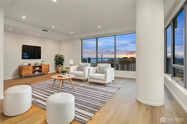a living room with furniture and a flat screen tv
