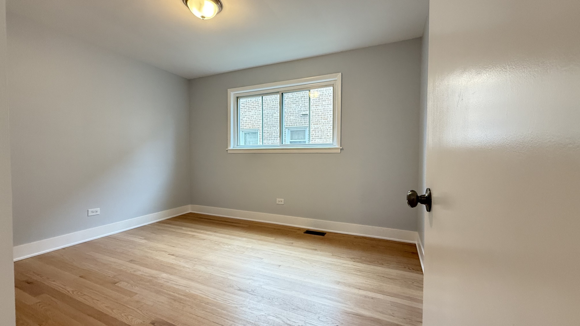 1345 North Latrobe Avenue Chicago, IL 60651 - Photo 12 of 50 wooden floor in an empty room with a window