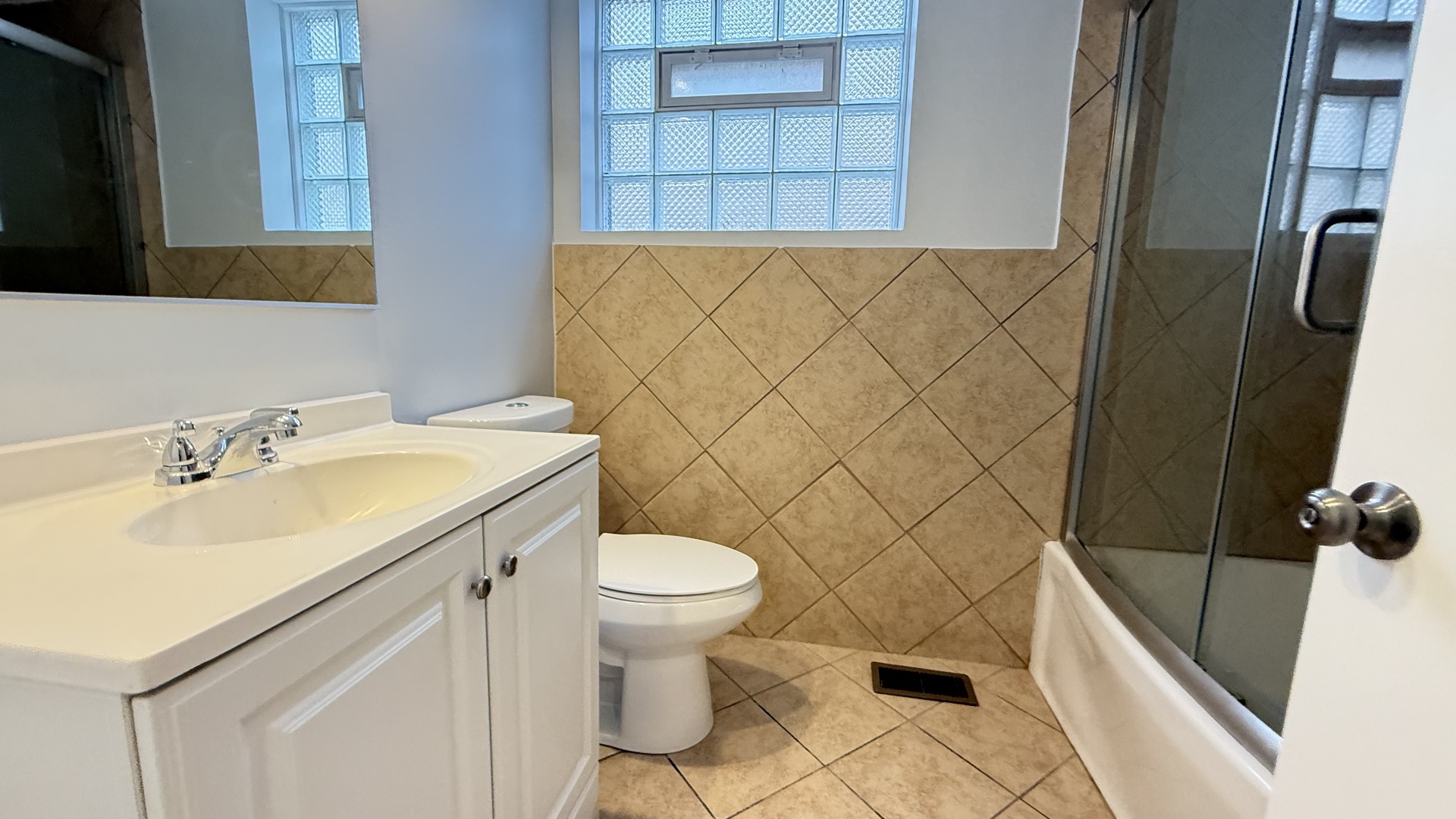 1345 North Latrobe Avenue Chicago, IL 60651 - Photo 16 of 50 a bathroom with a sink a toilet and shower