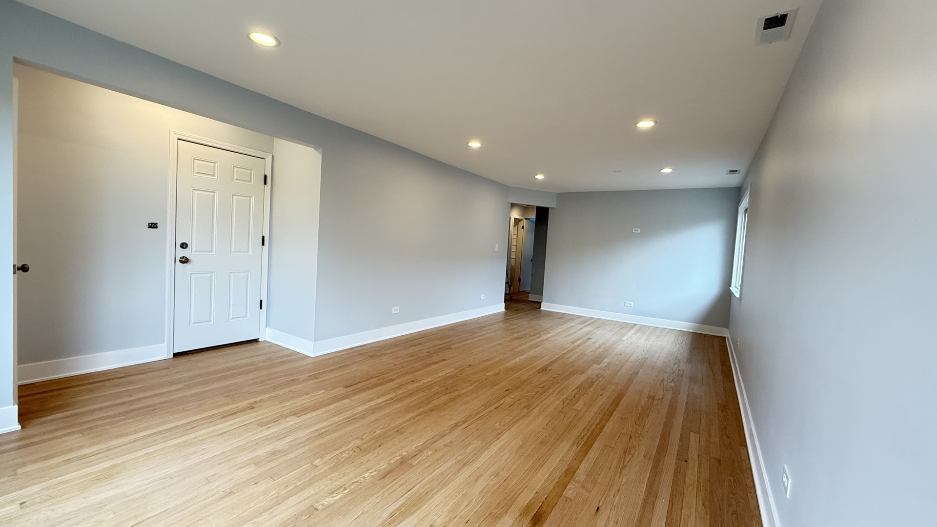 1345 North Latrobe Avenue Chicago, IL 60651 - Photo 23 of 50 a view of an empty room with wooden floor