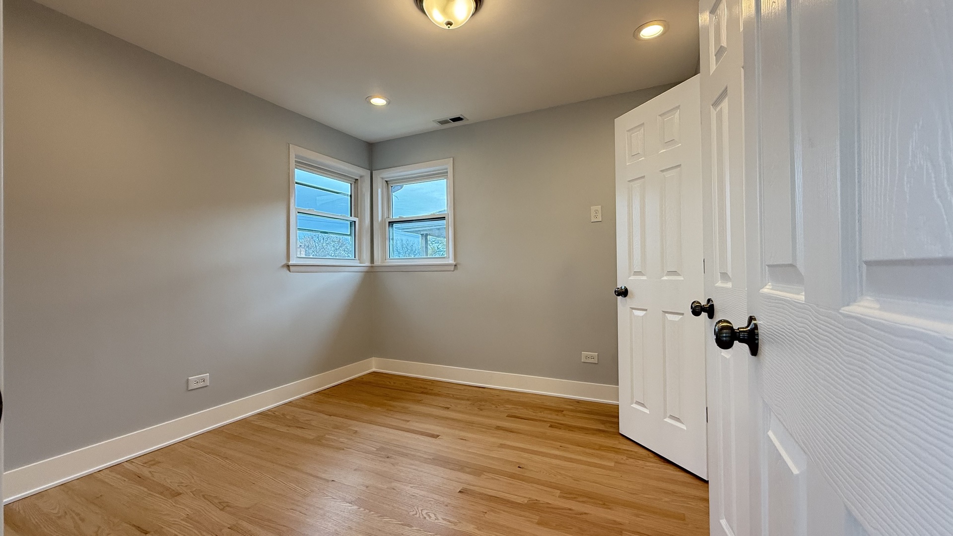1345 North Latrobe Avenue Chicago, IL 60651 - Photo 31 of 50 wooden floor in an empty room with a window